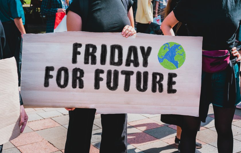 The phrase " Friday For Future " drawn on a carton banner in woman's hand. Movement against climate change. A girl holds a cardboard with an inscription: Friday For Future (öffnet Vergrößerung des Bildes) (öffnet Vergrößerung des Bildes)